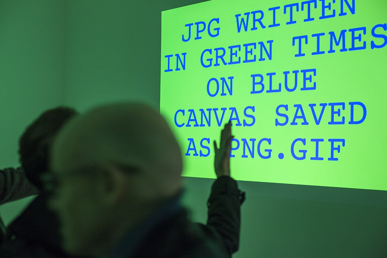 Green video projection JPG WRITTEN IN GREEN TIMES ON BLUE CANVAS SAVED AS PNG.GIF