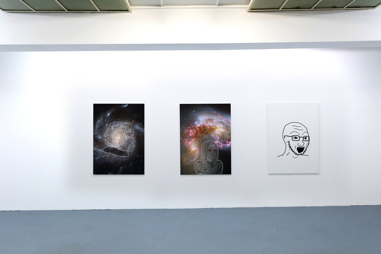 Three framed works with galaxies and a Soyboy face